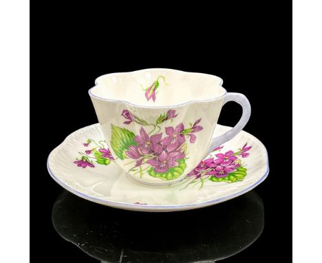 Vintage white bone china with vibrant purple flowers, violet rims. Dainty shape. Tea cup 4"L x 3.5"W x 2.5"H. Saucer 0.75"H x