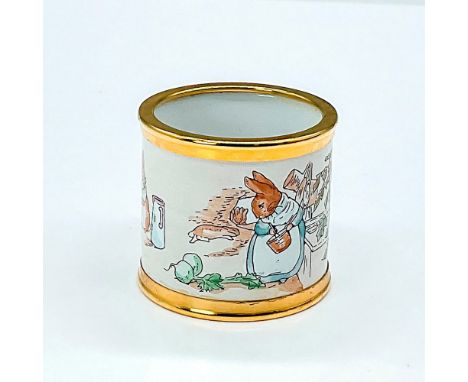 Gold rimmed napkin ring depicts a scene from The Tales of Peter Rabbit. This pieces features a quote from the popular storybo