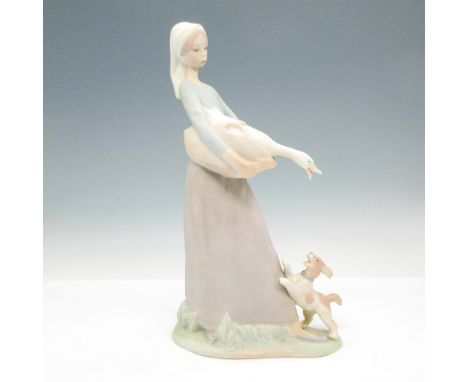 Matte finish on standing figural colored in soft cream, tan and blue. NAO backstamp. Issued: 20th centuryDimensions: 5.25"L x