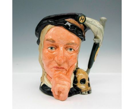 This glazed figural is part of the Shakespearean Collection. Colored in black cap and robe with a skull on his shoulder and a