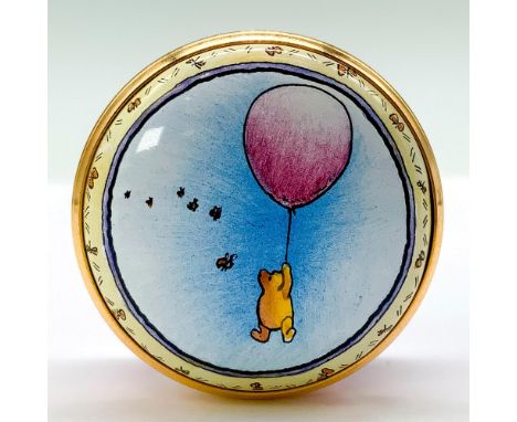 A light pink trinket box depicting Winnie the Pooh floating through the sky with a pink balloon. The interior cap reads ... a