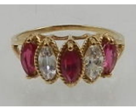 A 10 carat yellow gold, cut glass, and ruby ring, set three marquise cut rubies. 