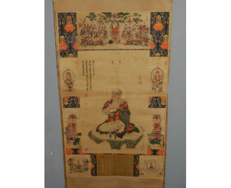 A Chinese scroll, printed with seated Buddha to centre, within panels depicting religious scenes.