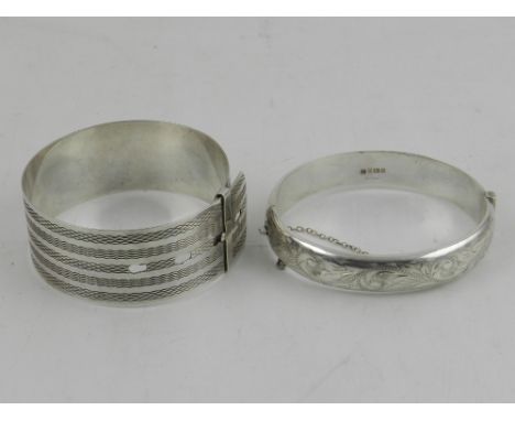 A silver bangle, hallmarked Birmingham 1981, together with a sterling silver bangle.