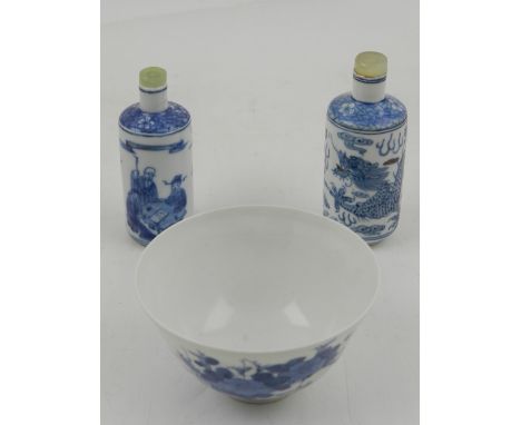 A collection of three Oriental items, to include two Chinese blue and white snuff bottles with jade / hardstone stoppers, one