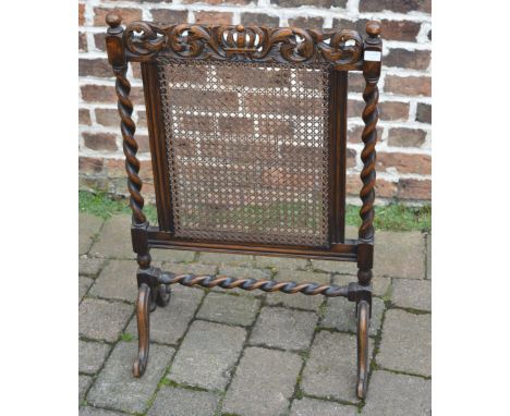 Cane work and carved firescreen