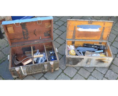 2 wooden trunks containing tools