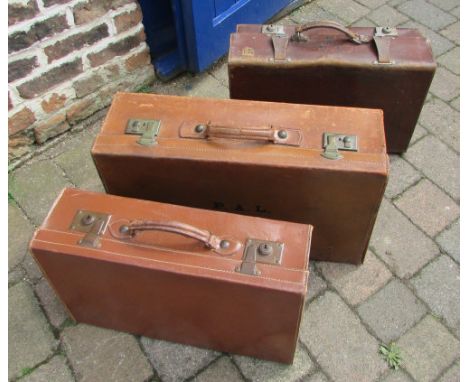 3 vintage leather suitcases