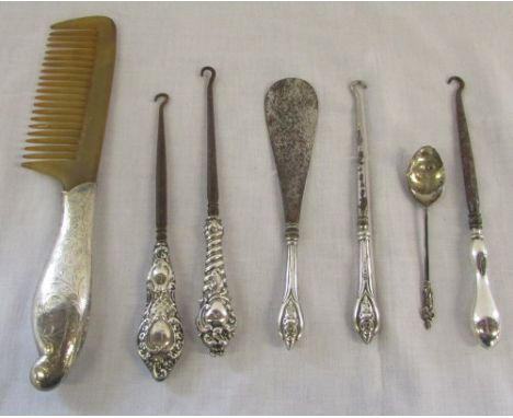 Assorted silver handled button hooks, shoe horn, comb and a teaspoon 