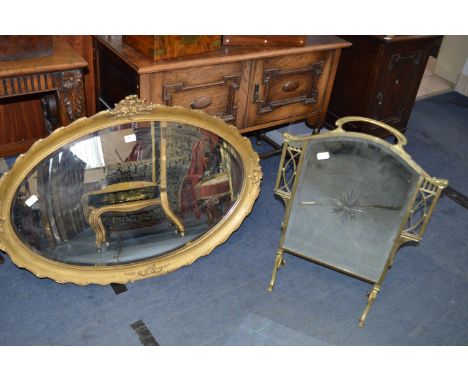 Gilt Framed Oval Bevelled Edge Wall Mirrors and a Mirrored Brass Firescreen 