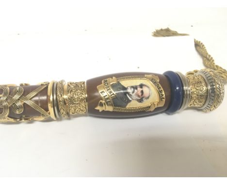 An American marching Caine depicting a retrospective portrait of General Robert E Lee with applied gilt metal decoration.
