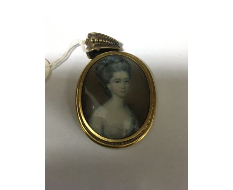 A small oval portrait locket unmarked gold frame 7 cm .