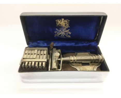 A rare vintage Wilkinson Sword 7 day razor set in original Art Deco case.