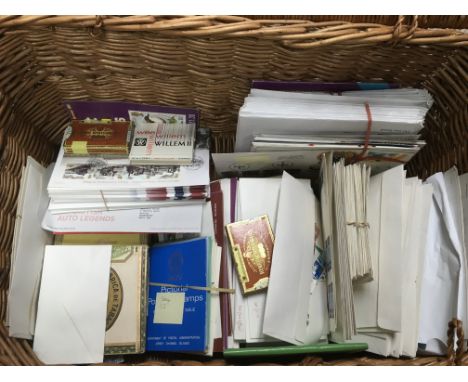 A hamper containing a collection of used GB and world stamps.