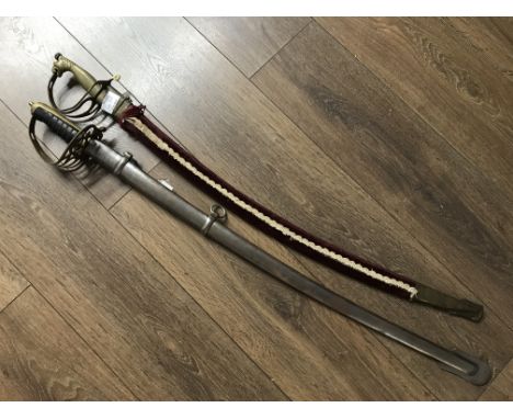 A naval dress sword with steel scabbard and an Indian dress sword