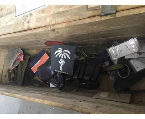 A retrospective German Third Reich ammunition box. Containing leather ammunition pouches gun holsters and other military oddm