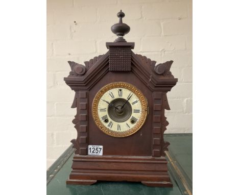 A Black Forest style mantle clock with Ansonia model.