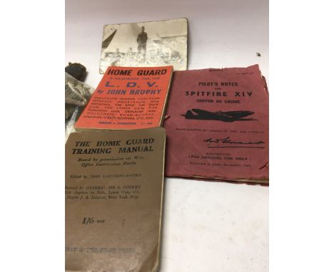 Military interest, home Guard manual spitfire pilots notes cap badges and a Kukri knife.