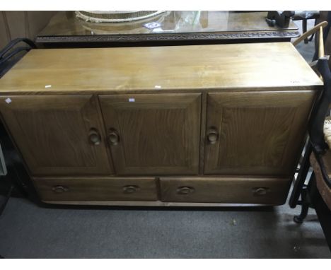 A blonde Ercol sideboard.