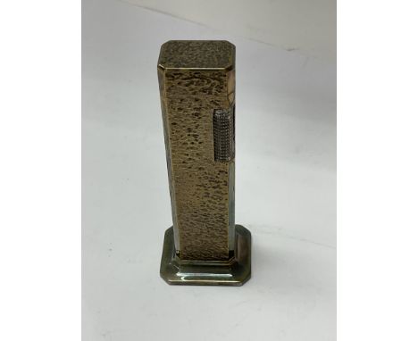 A tallboy Dunhill lighter.