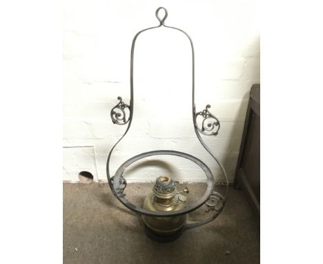 A brass hanging lamp and one other lamp.