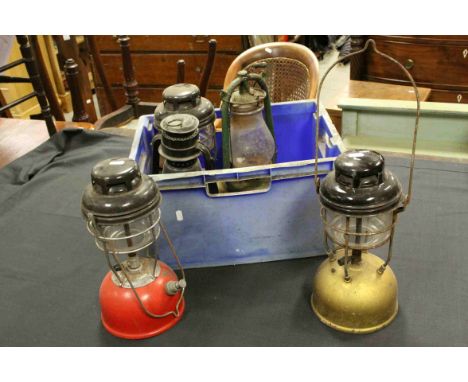 Three Tilley Lamps together with a Chalwyn Storm Lamp and another similar Storm Lamp