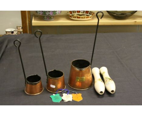 Set of Three Copper Hanging Graduating Cider Measures together with Two Ceramic Hunting Scene Beer Pump Handles