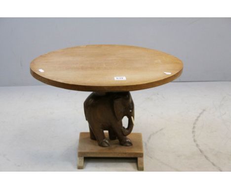 African Hardwood Lamp Table, the oval top above an Elephant Column with Bone Tusks