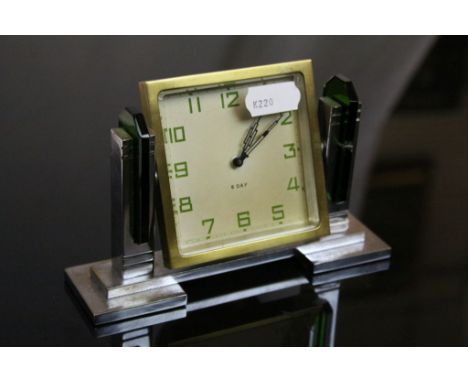 Art Deco 8 day dressing table clock, square champagne dial with green Arabic numerals, black stepped pencil hands, gilt metal