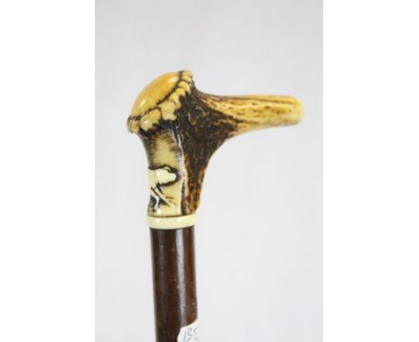 Antique Walking Stick with Carved Dog decoration to the Antler Handle