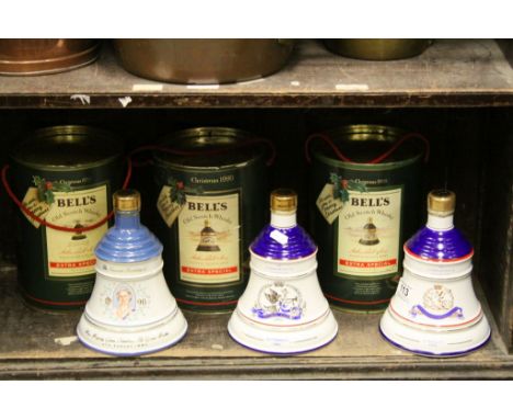 Three Tinned Wade Ceramic ' Bells ' Christmas Whiskey Bell Decanters 1988, 1989, 1990 together with Three similar Commemorati
