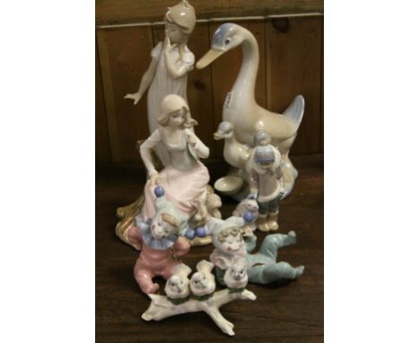 Lladro Figure of a Child with Polar Bear model no. 5238, Nao Figure of a Girl Yawning, Two Nao Children dressed as Clowns plu