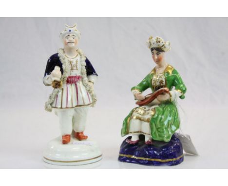 Pair of 19th century Staffordshire Figures comprising a Persian Man and Woman, the man wearing a turban and holding a pipe, t