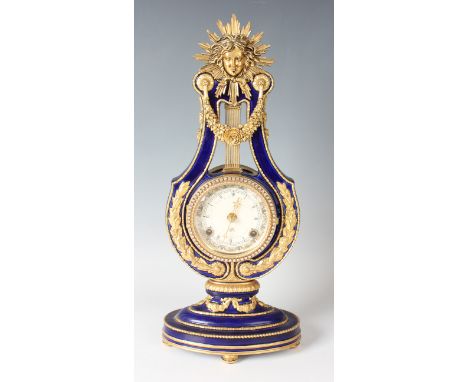 A late 20th century Victoria &amp; Albert Museum gilt metal and blue glazed pottery 'Marie Antoinette' mantel clock with Fran