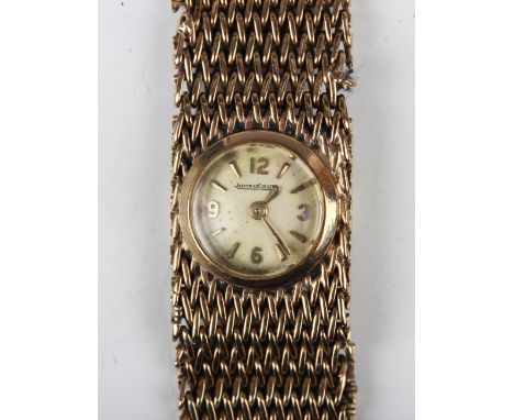 A Jaeger-LeCoultre 9ct gold rear winding lady's bracelet wristwatch, the signed silvered dial with gilt Arabic numerals and b