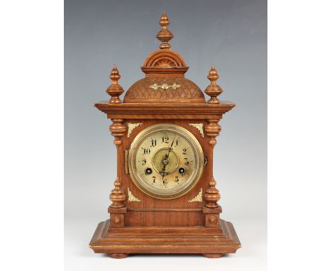 A late 19th century German beech cased mantel clock with Junghans eight day movement, height 42cm, with pendulum, together wi