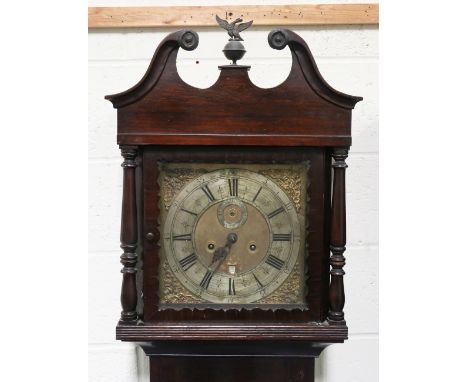 A late 18th century stained oak longcase clock with eight day movement striking on a bell, the 12-inch square brass dial with