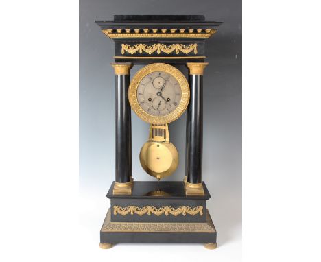 A mid-19th century French ormolu and ebonized portico mantel clock with eight day movement striking on a bell via an outside 