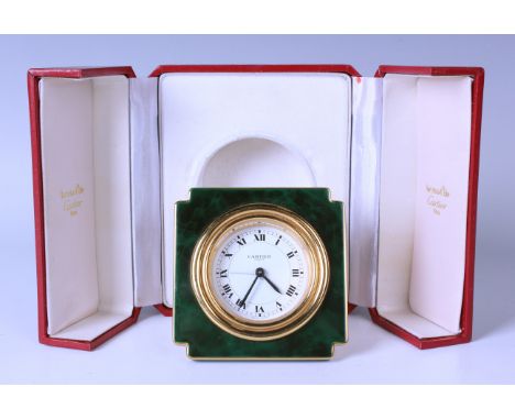 A Cartier Paris gilt brass and simulated jade enamelled bedside alarm clock of square form, the signed white circular dial wi