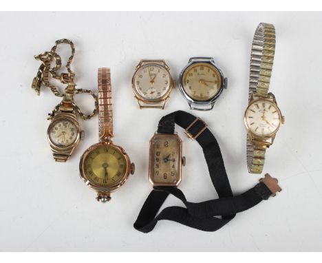 A Rotary 9ct gold circular cased lady's wristwatch, case diameter 1.7cm, on a gilt metal fronted expanding metal bracelet, to