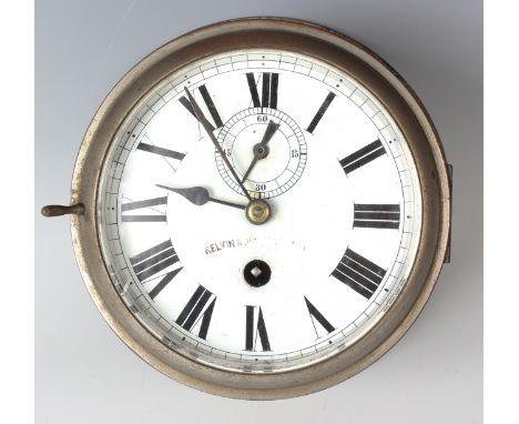 An early 20th century brass cased circular ship's timepiece, the enamelled circular dial with black Roman hour numerals and s