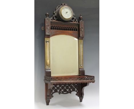 A late Victorian mahogany wall shelf with circular barometer surmount above a bevelled mirror back panel and mercury thermome