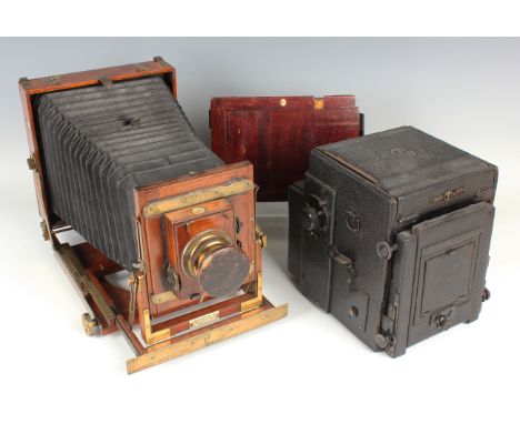 A Thornton Pickard 'Triple Imperial Extension' mahogany and lacquered brass half plate field camera with black leather bellow