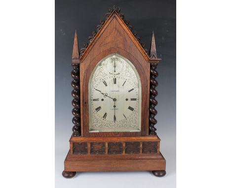 A late Victorian Gothic Revival rosewood bracket clock with eight day triple fusee movement chiming on eight bells and striki