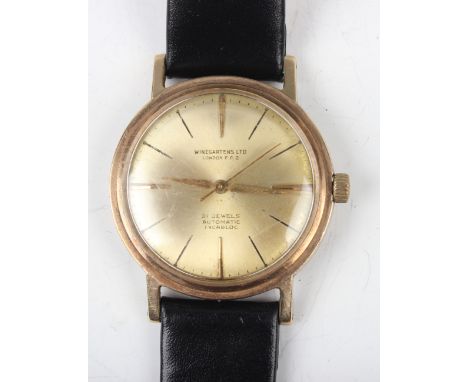 A Winegartens Automatic 9ct gold circular cased gentleman's wristwatch with signed and jewelled movement, the signed gilt dia