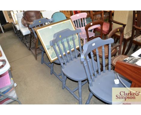 A set of four grey painted stick back chairs