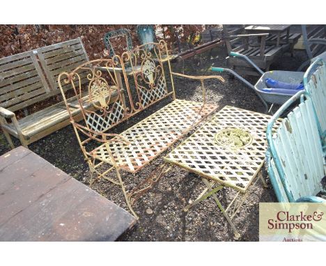 A metal garden bench with similar folding table