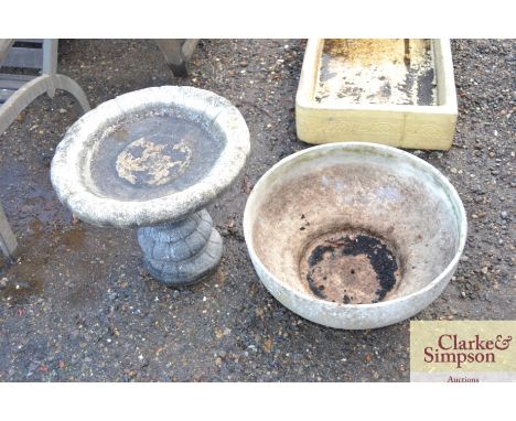 A cement fibre planter together with a concrete bird bath on plinth