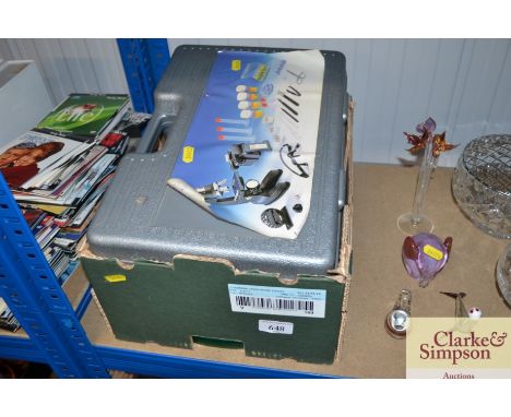 A box containing child's microscope and Top Trump cards