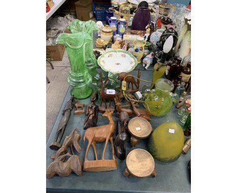 A LARGE COLLECTION OF WOODEN ANIMAL FIGURES, GLASS VASES, LAMP ETC 